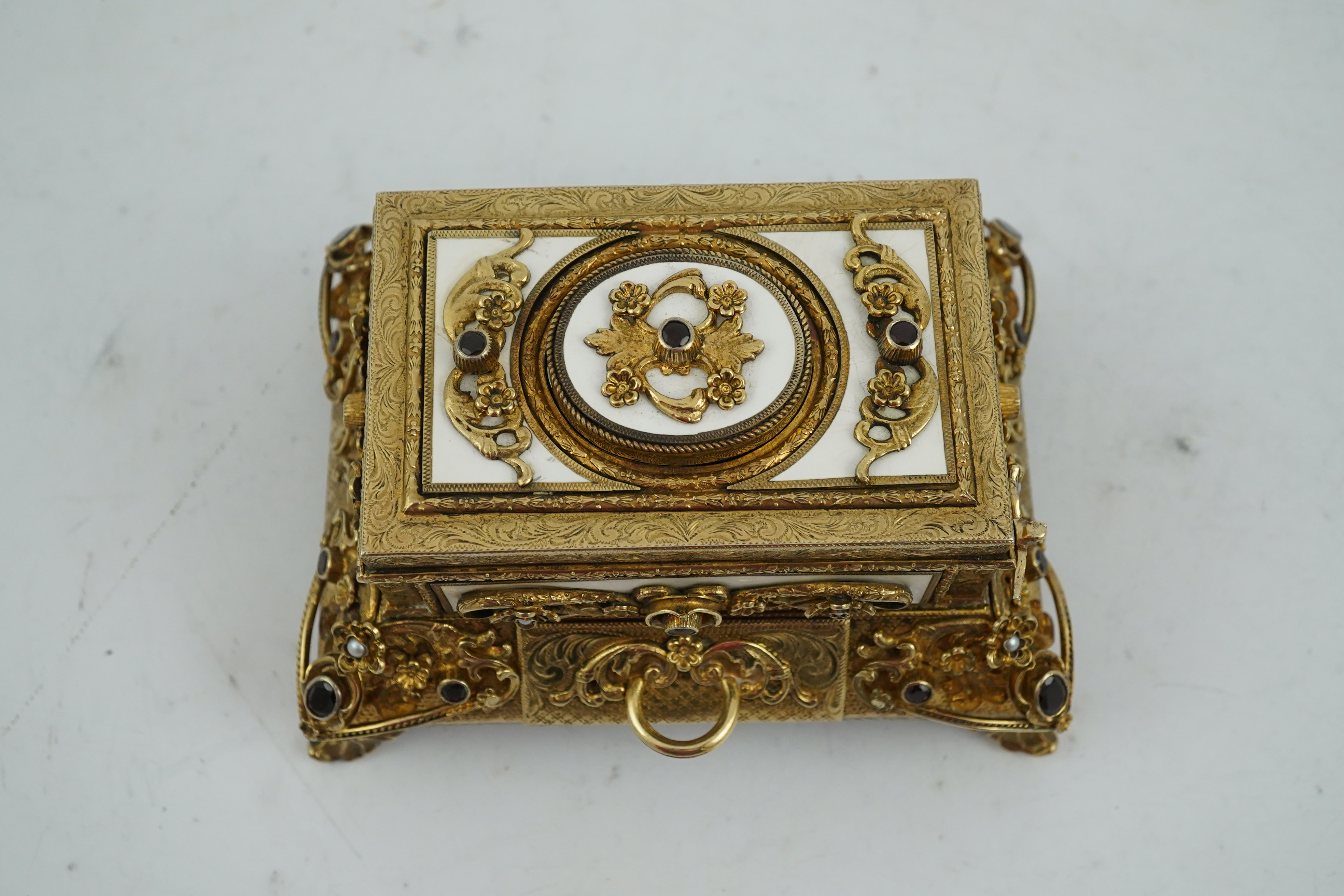 A late Karl Griesbaum Model 17 silver gilt, white enamel, garnet and cultured pearl set automaton singing bird box